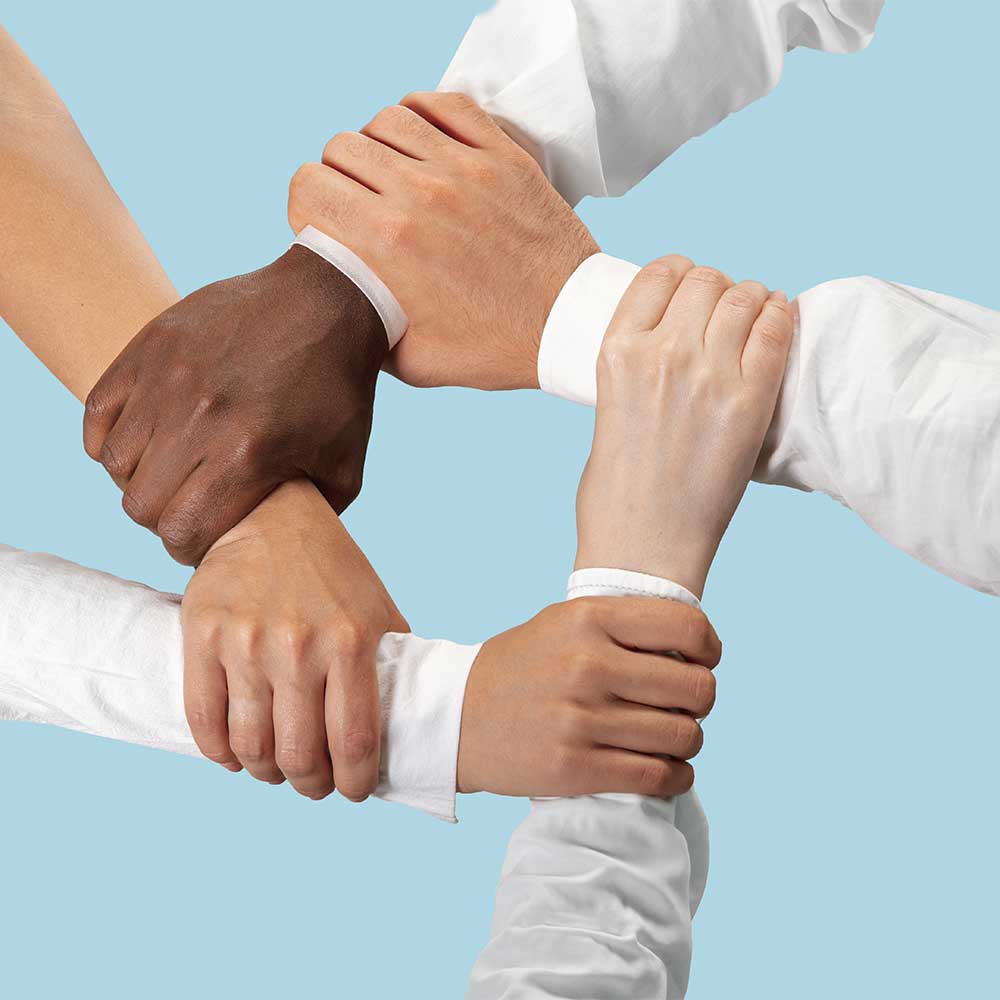 Team holding hands supporting their clients